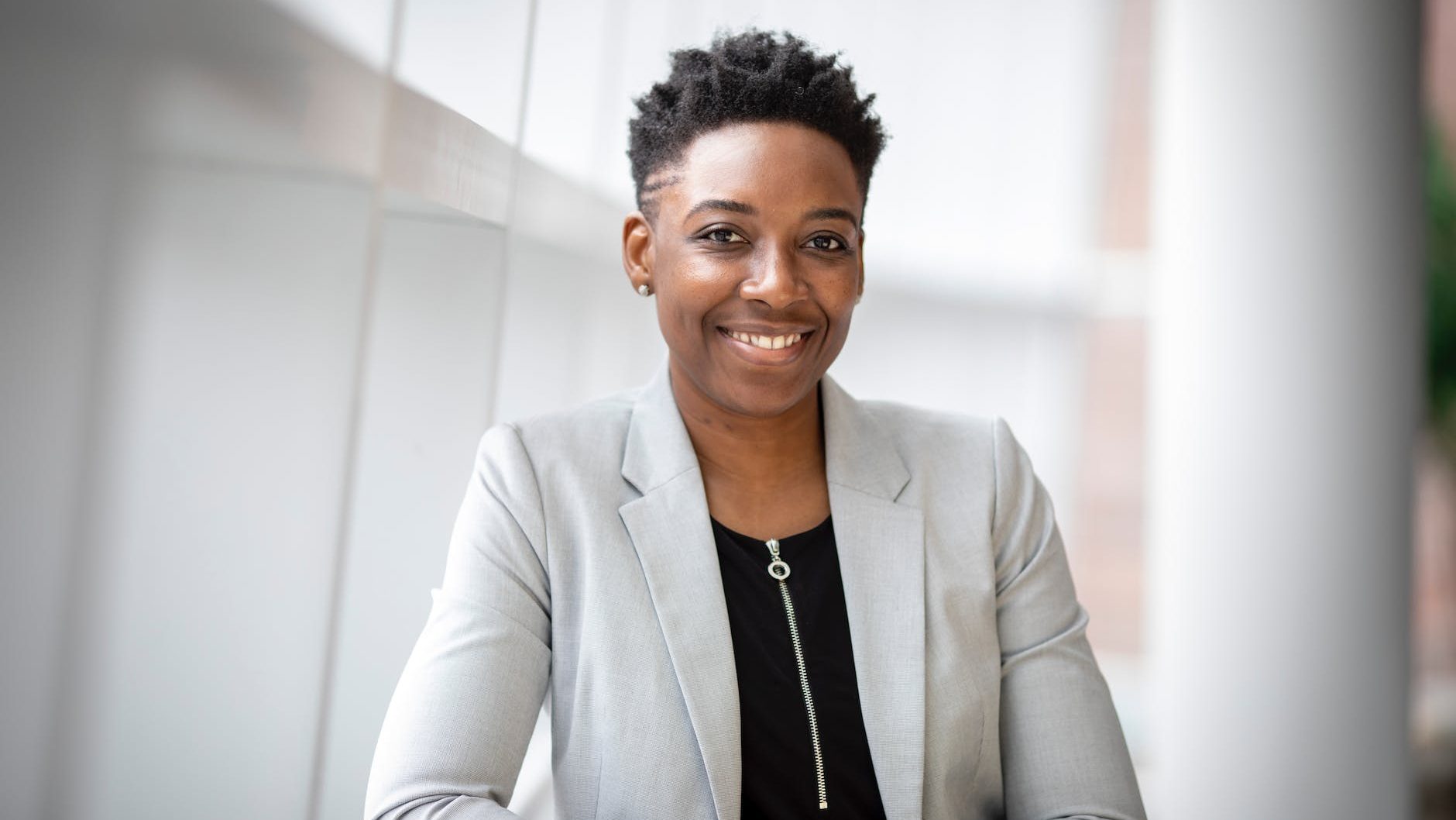 woman wearing gray notch lapel suit jacket